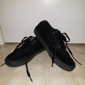 Solid black Vans